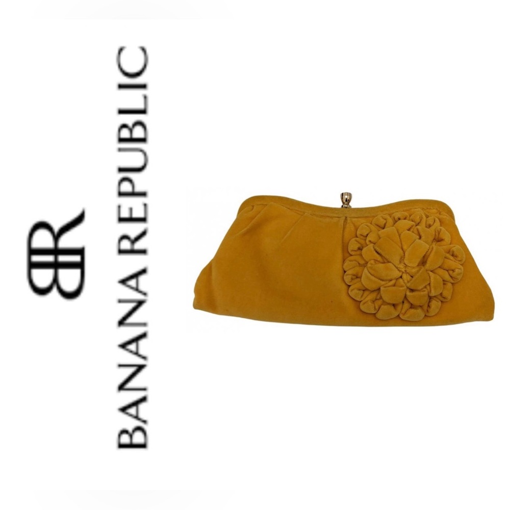 Banana Republic velvet clutch with flower accent in marigold yellow